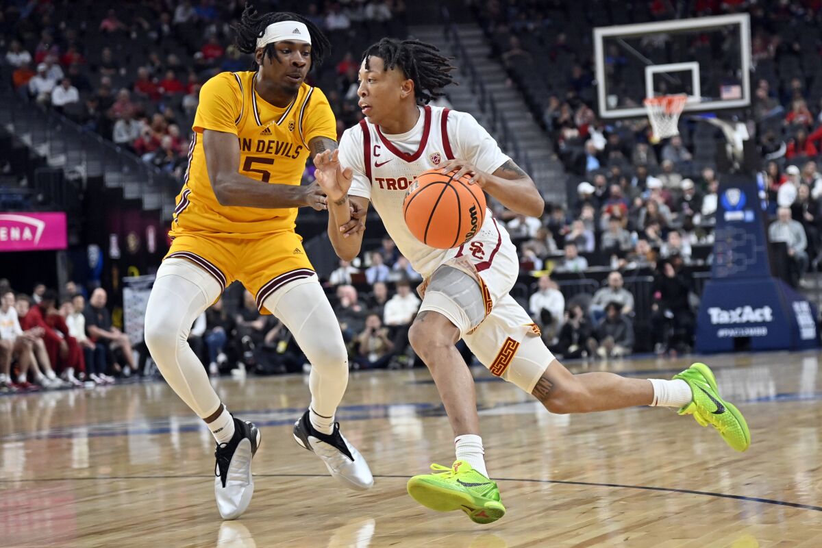 USC guard Boogie Ellis drives against Arizona State forward Jamiya Neal in the Pac-12 tournament on Thursday in Las Vegas.