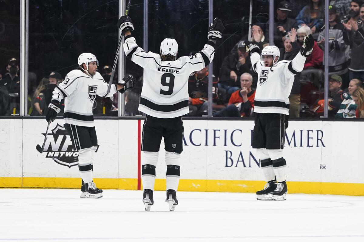 Kings captain Anze Kopitar, right, celebrates with Adrian Kempe, center, and Alex Iafallo after scoring in the second period.