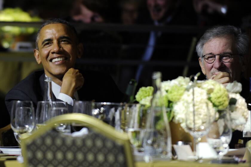 President Obama, left, sits next to movie director Steven Spielberg at the USC Shoah Foundation's 20th anniversary Ambassadors for Humanity gala in Los Angeles.