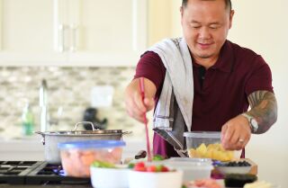 LOS ANGELES-CA-AUGUST 8, 2017: Chef Jet Tila packs his kids’ lunch box with Thai BBQ chicken, sticky