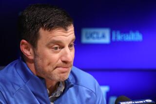 Andrew Friedman answers a question from the media at the end-of-season wrap up at Dodger Stadium.