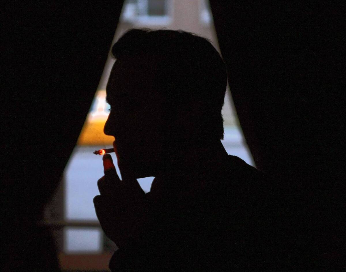 A man smoking a cigarette