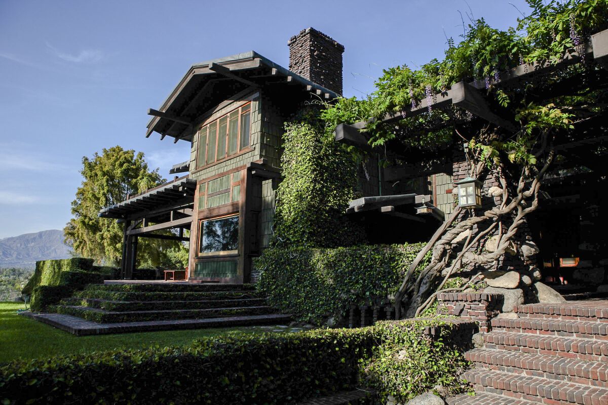 The Greene and Greene-designed Duncan Irwin house is surrounded by greenery