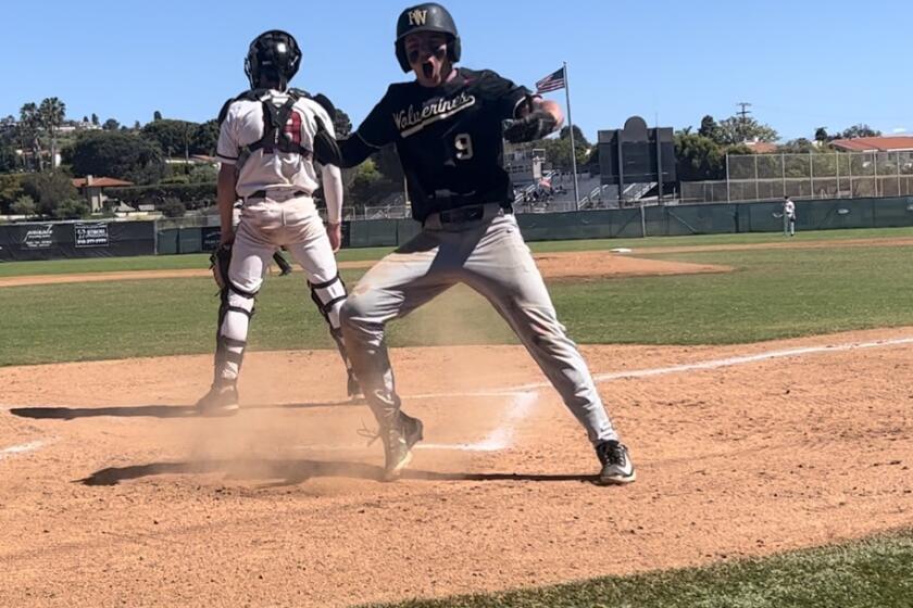 Cade Goldstein is fired up scoring on a wild pitch in the top of the 14th inning to give Harvard-Westlake a 1-0 win