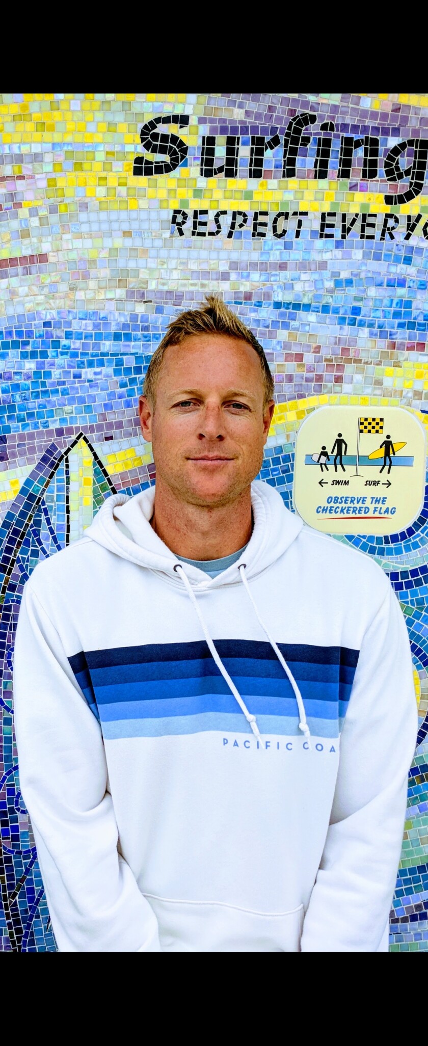 Neil Garrett received the Carnegie Medal for helping to rescue a young girl in La Jolla in 2020.