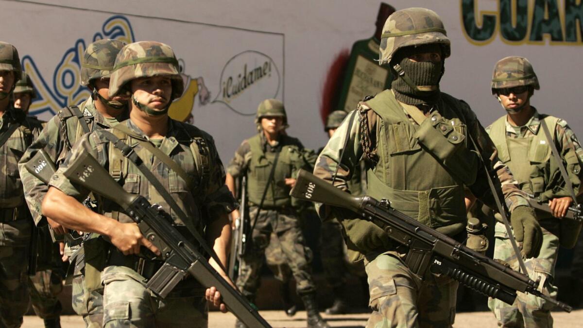 Mexican soldiers patrol the state of Michoacan in 2006, the year Mexico first deployed the military to fight against drug cartels.