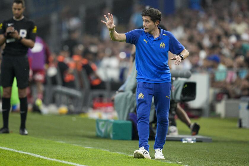 Marseille's head coach Marcelino calls out to his players during the French League One soccer match between Marseille and Brest at the Velodrome stadium in Marseille, France, Saturday, Aug. 26, 2023. (AP Photo/Daniel Cole)
