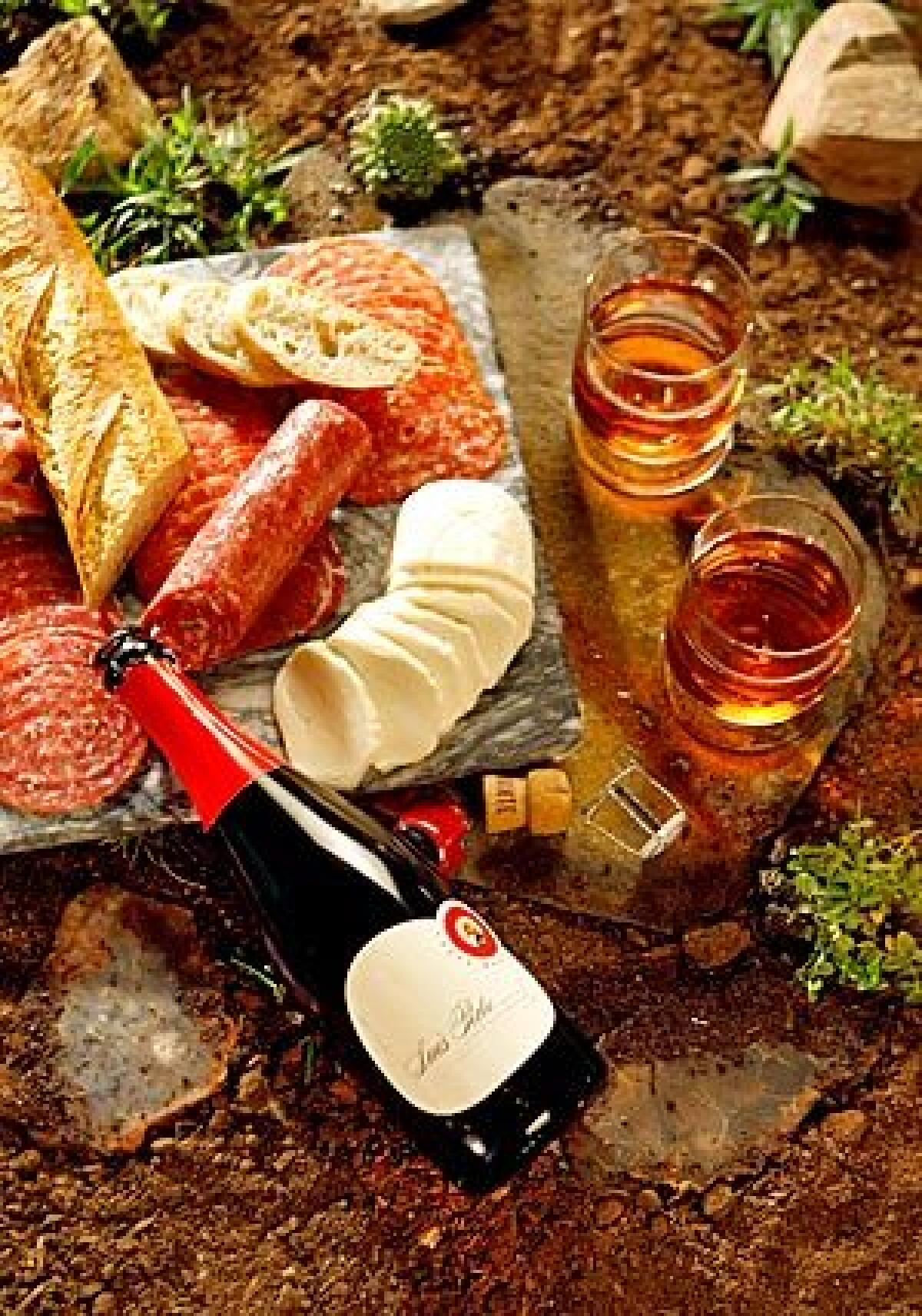Luís Pato's robust Casta Baga accompanies a platter of cheese, salumi and bread.