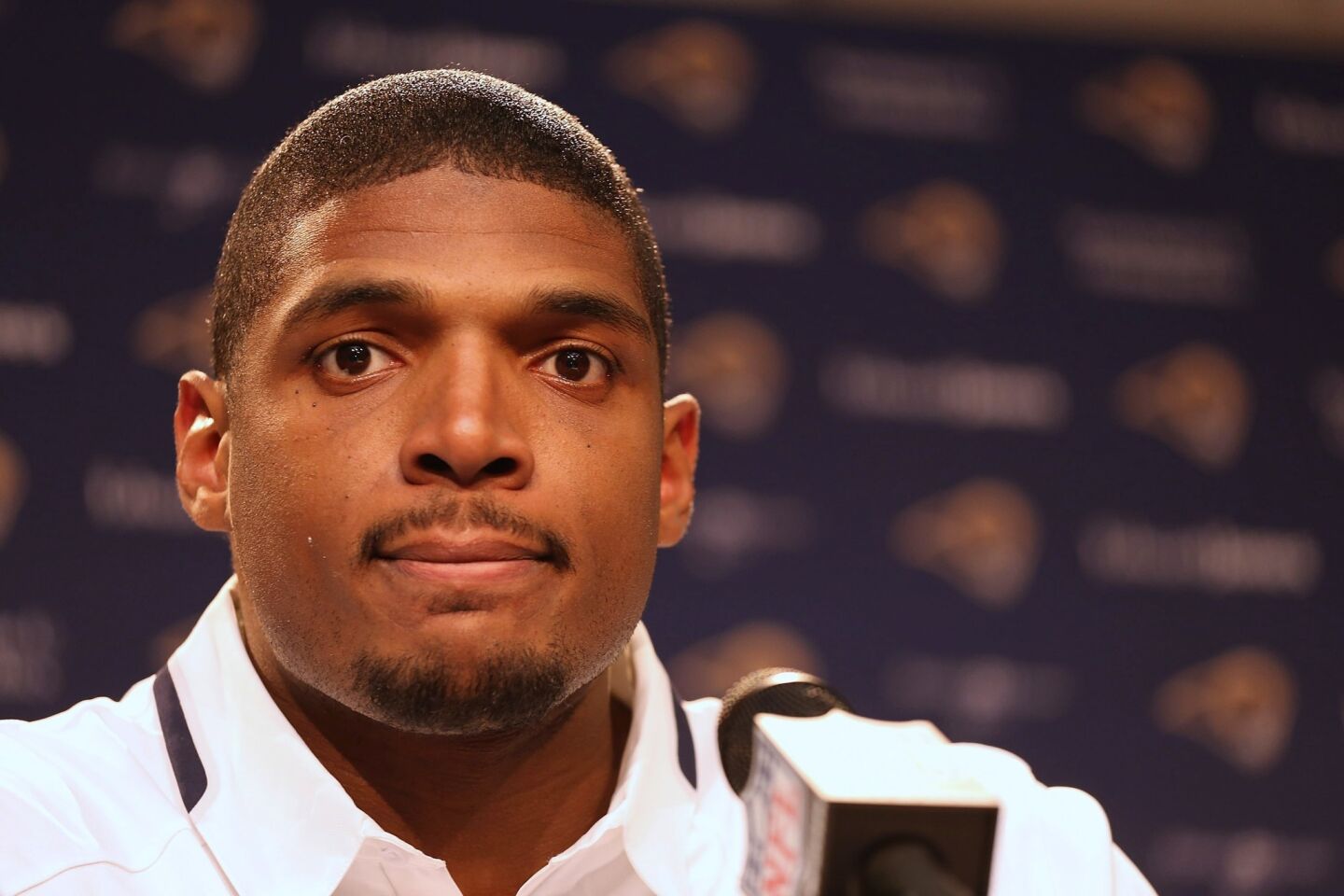 Michael Sam addresses reporters during a news conference after being selected by the St. Louis Rams in the seventh round of 2014 NFL draft in May.