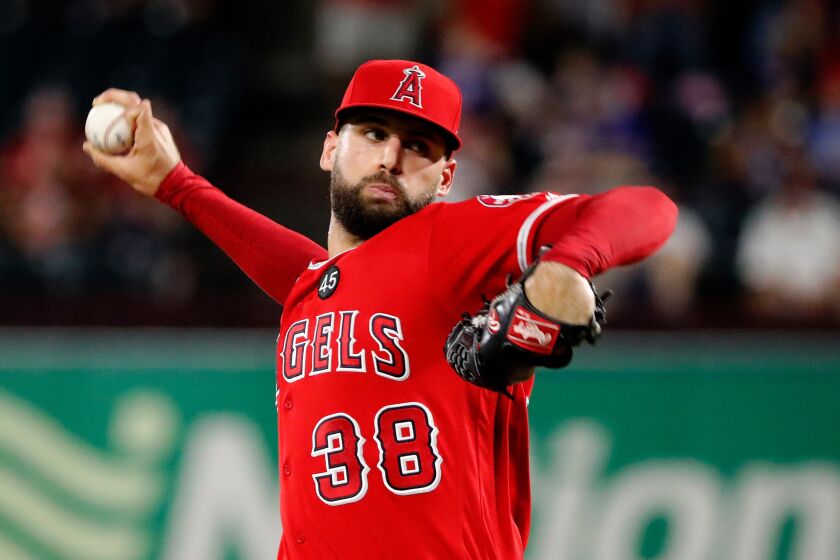 Los Angeles Angels relief pitcher Justin Anderson throws to the Texas Rangers.
