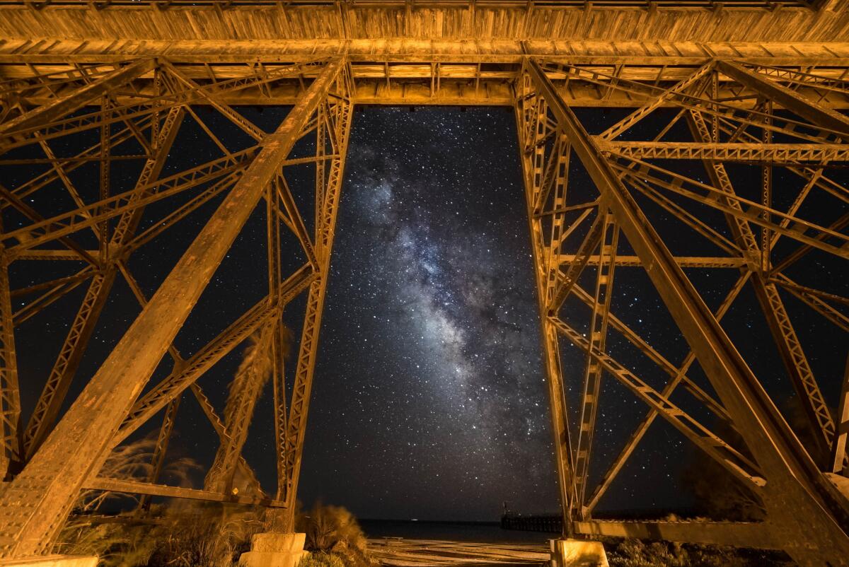 The Milky Way is framed by an old railroad trestle at Gaviota State Park.
