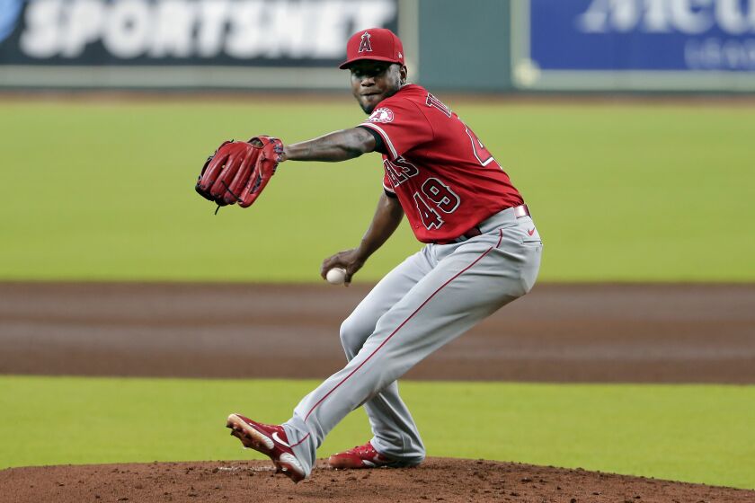 Los Angeles Angels starting pitcher Julio Teheran throws against the Houston Astros during the first inning of the second game of a doubleheader baseball game Tuesday, Aug. 25, 2020, in Houston. (AP Photo/Michael Wyke)