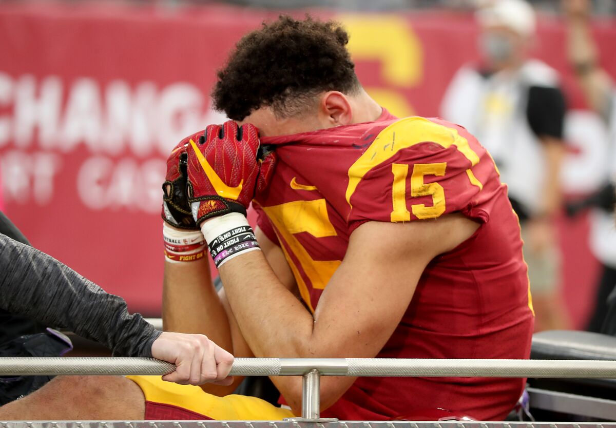 USC wide receiver Drake London is carted off the field after sustaining an ankle injury on a touchdown catch.