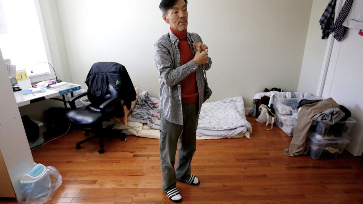 Seon Jin Kim shares a room with another tenant in Adullam, an unofficial homeless shelter for Koreans in Koreatown.