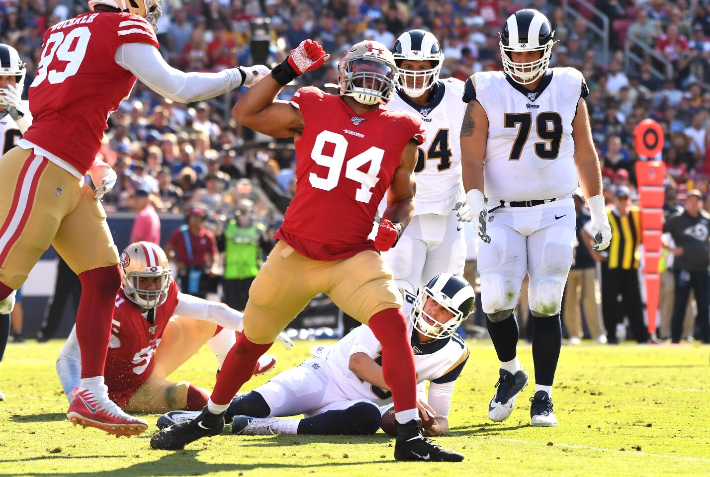 LOS ANGELES, CALIFORNIA OCTOBER 13, 2019-49ers defensive lineman Solomon Thomas (94) celebrates his sack of Rams Jared Goff in the 3rd quarter at the Coliseum Sunday. (Wally Skalij/Los Angeles Times)