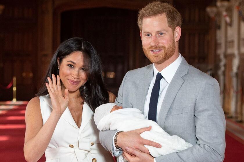 Britain's Prince Harry, Duke of Sussex (R), and his wife Meghan, Duchess of Sussex, pose for a photo with their newborn baby son in St George's Hall at Windsor Castle in Windsor, west of London on May 8, 2019. (Photo by Dominic Lipinski / POOL / AFP)DOMINIC LIPINSKI/AFP/Getty Images ** OUTS - ELSENT, FPG, CM - OUTS * NM, PH, VA if sourced by CT, LA or MoD **