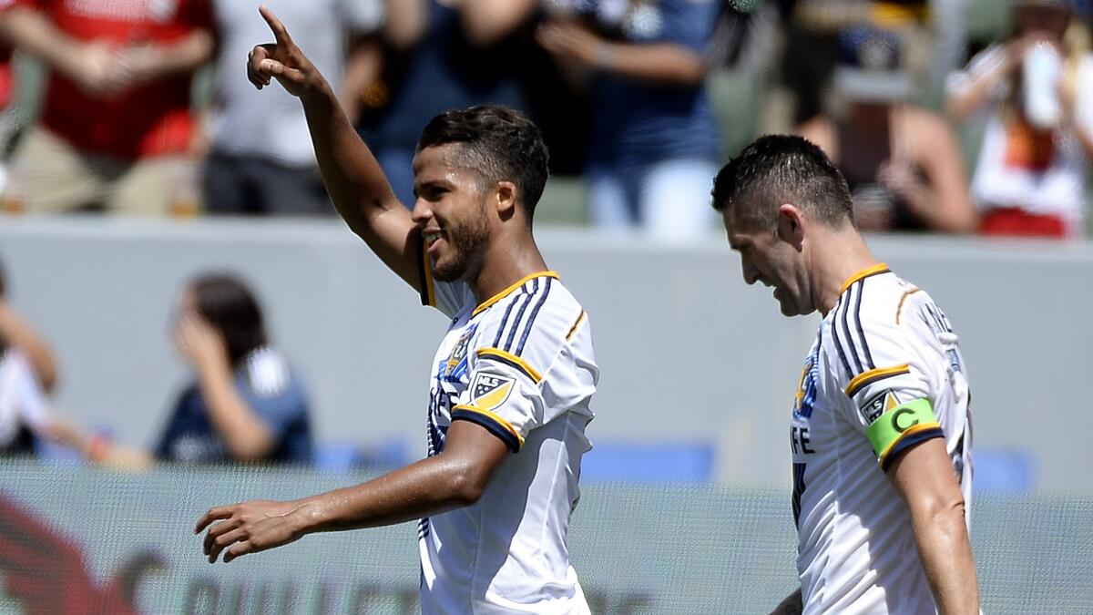 Galaxy midfielder Giovani Dos Santos, celebrating a goal alongside teammate Robbie Keane, should be back in the lineup Saturday after recovering from a groin injury.