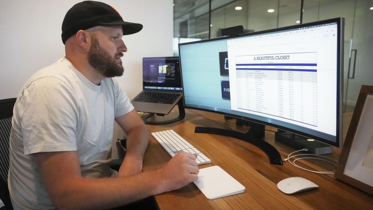Jake Welch looks at a spreadsheet on his computer Wednesday, Aug. 2, 2023