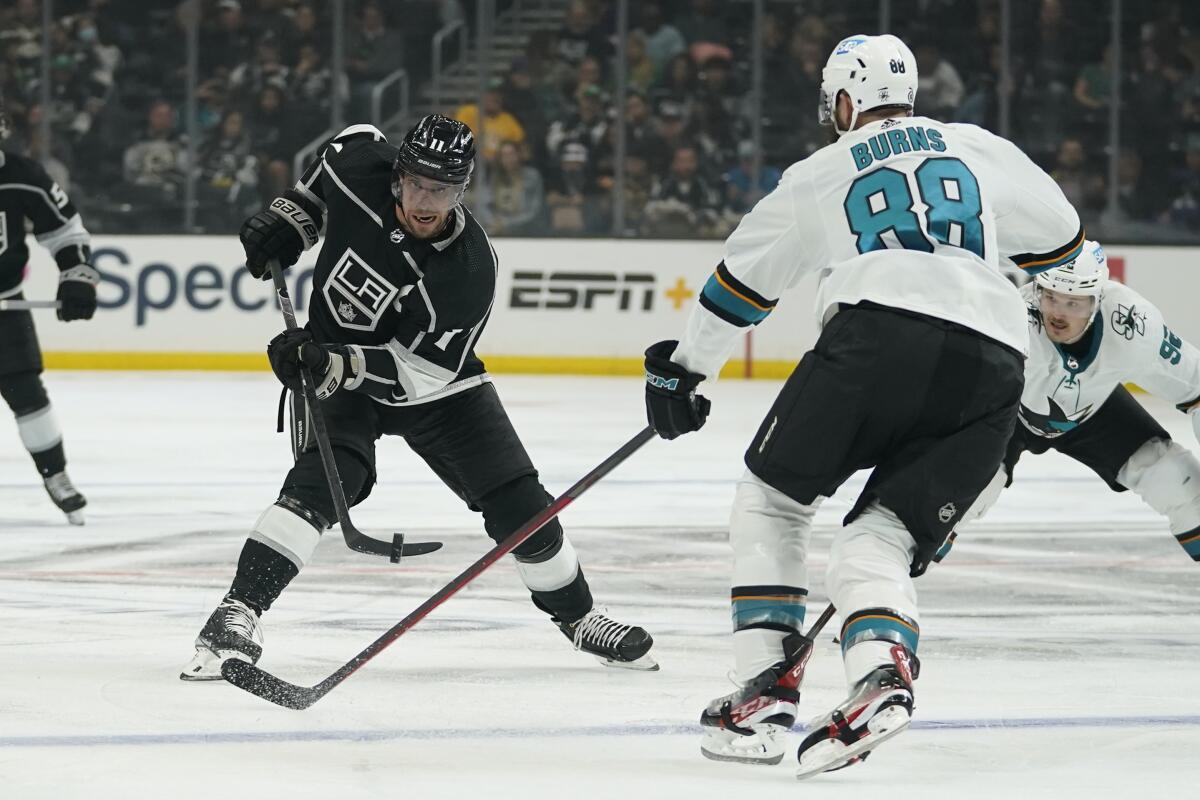 Kings center Anze Kopitar shoots against San Jose Sharks defenseman Brent Burns.