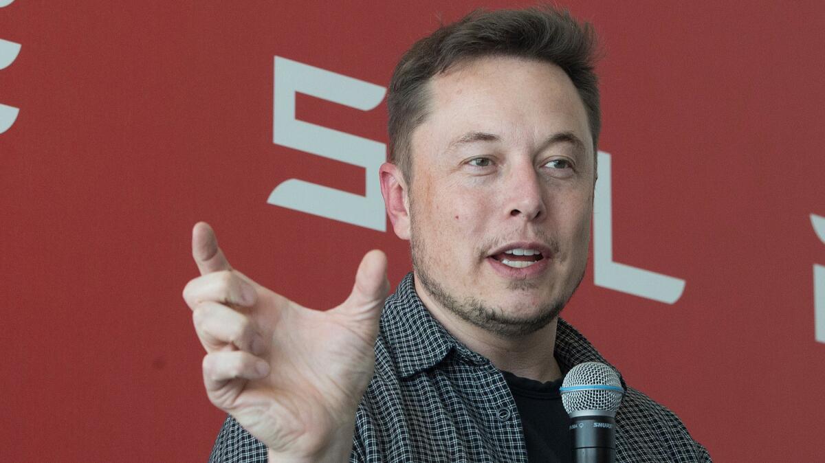 Elon Musk speaks at Tesla Motors' giant battery factory outside Reno in July.