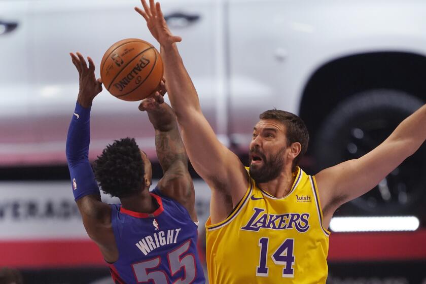 Detroit Pistons guard Delon Wright (55) shoots over the defense of Los Angeles Lakers center Marc Gasol (14) during the first half of an NBA basketball game, Thursday, Jan. 28, 2021, in Detroit. (AP Photo/Carlos Osorio)