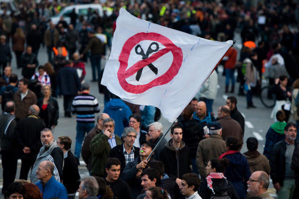 Protesters converge in Barcelona in opposition to austerity cuts.