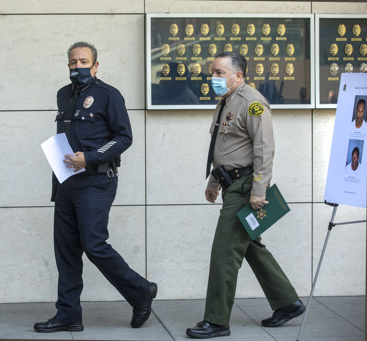 LAPD Chief Michel Moore, left,  with Los Angeles County Sheriff Alex Villanueva.