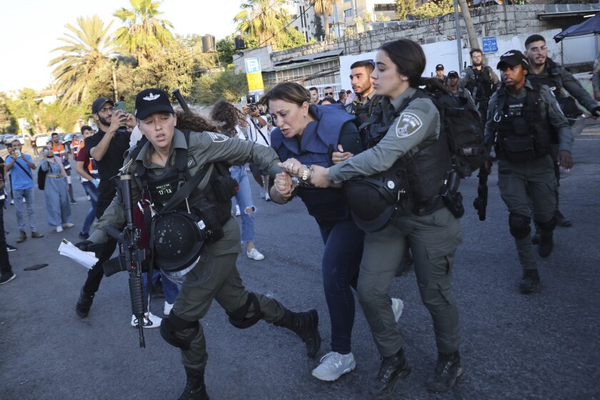 Israeli police arrest Al Jazeera journalist Givara Budeiri during a protest in   east Jerusalem.