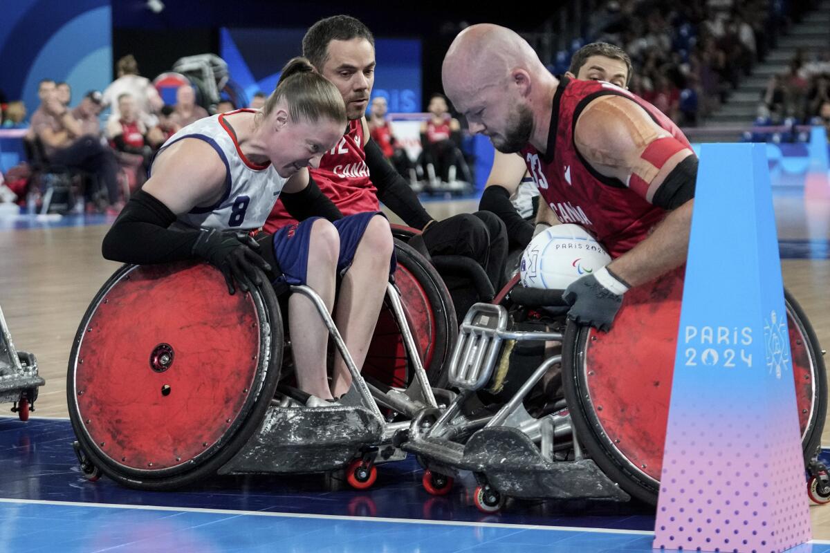 American Sarah Adam blocks Canada's Zachary Madel during the 2024 Paralympics wheelchair rugby match Thursday in Paris.