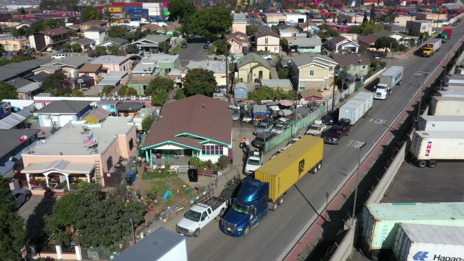 Trucks from L.A.'s port rumble down their tiny street day and night. Residents have had it