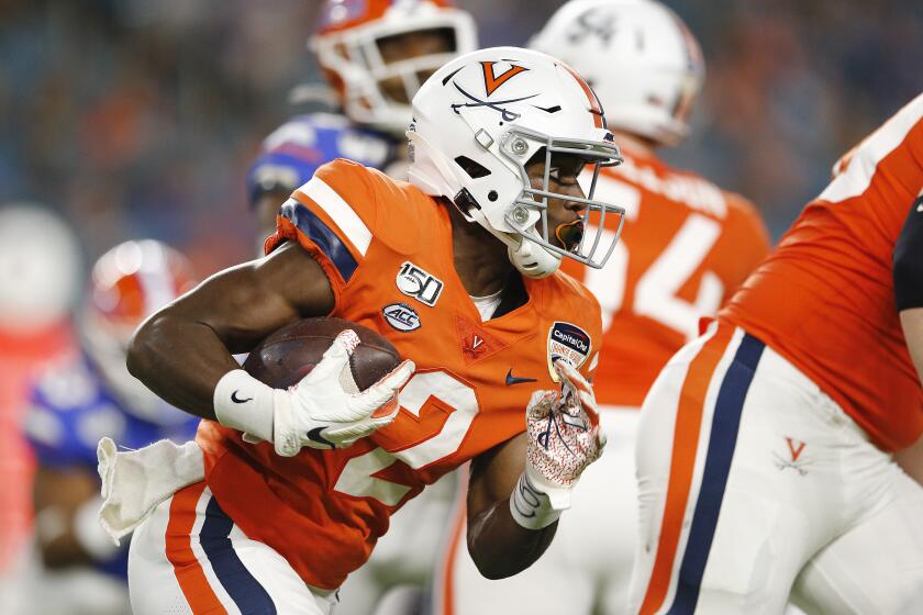 MIAMI, FLORIDA - DECEMBER 30: Joe Reed #2 of the Virginia Cavaliers runs with the ball against the Florida Gators during the first half of the Capital One Orange Bowl at Hard Rock Stadium on December 30, 2019 in Miami, Florida. (Photo by Michael Reaves/Getty Images)