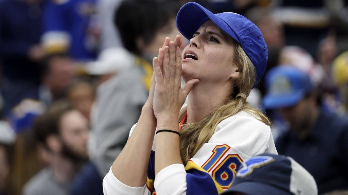 A St. Louis Blues fan reacts as the Boston Bruins pull ahead during Game 6 of the Stanley Cup Final on June 9.