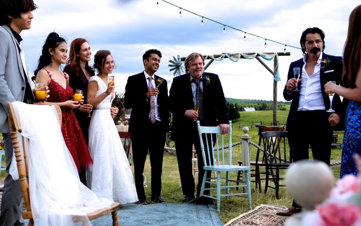 A group of friends toasting the brides