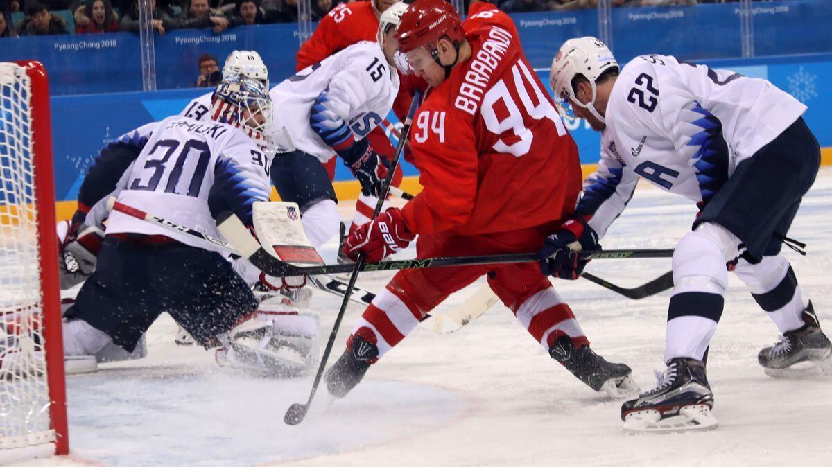 Alexander Barabanov (94) of the Olympic Athletes From Russia team looks back for the puck during a Group B game against the United States at the Pyeongchang Olympics on Saturday.