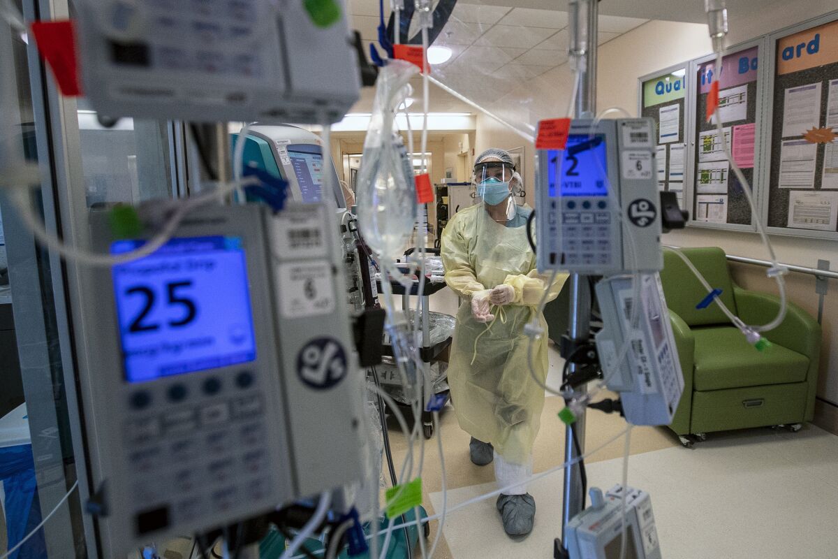 A healthcare worker in an intensive care unit in Colton, Calif., on Dec. 23, 2020. 