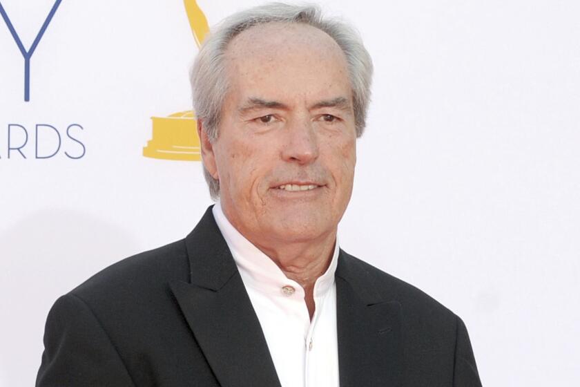 FILE - In this Sept. 23, 2012 file photo, Powers Boothe arrives at the 64th Primetime Emmy Awards in Los Angeles. Boothe, the character actor known for his villain roles in TVÃ¢â¬â¢s Ã¢â¬ÅDeadwood,Ã¢â¬Â and in the movies Ã¢â¬ÅTombstone,Ã¢â¬Â Ã¢â¬ÅSin CityÃ¢â¬Â and Ã¢â¬ÅThe Avengers,Ã¢â¬Â died Sunday, May 14, 2017. He was 68. (Photo by Jordan Strauss/Invision/AP, File)