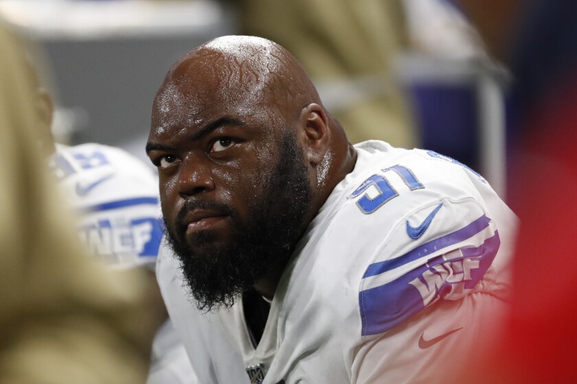 A'Shawn Robinson sits on the bench during a game between the Detroit Lions and Dallas Cowboys.