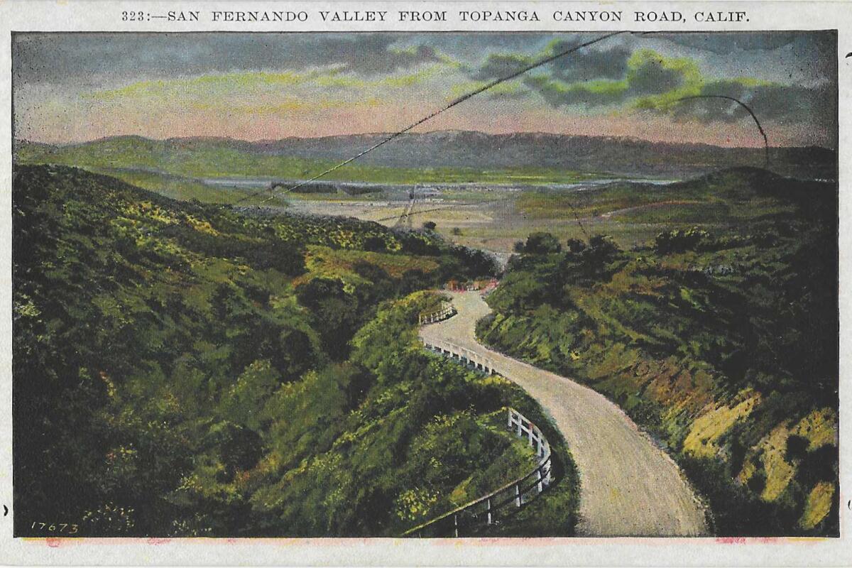 A winding road leads to the undeveloped San Fernando Valley on this vintage postcard