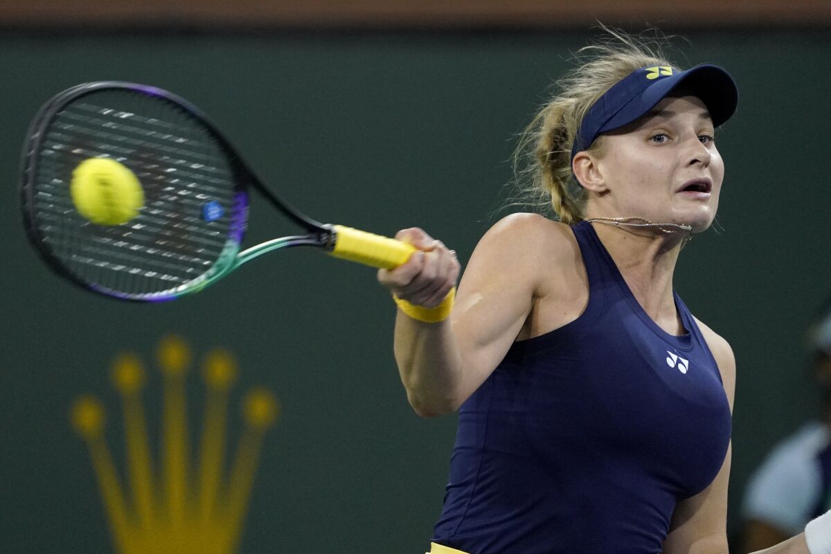 Dayana Yastremska, of Ukraine, returns to Caroline Garcia, of France.