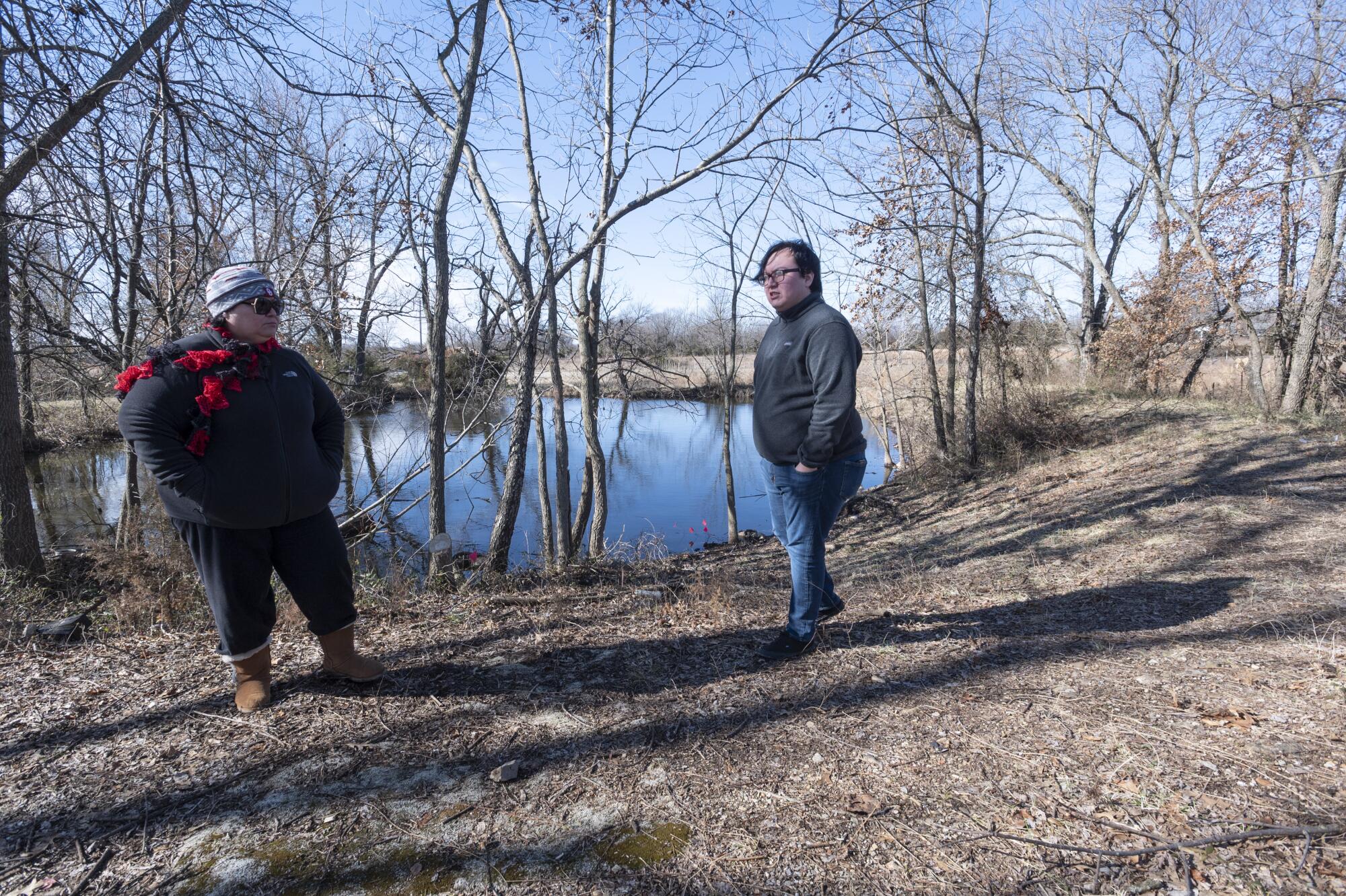 Smith, left, and Fencer stand near a pond close to where Dameron was last seen.