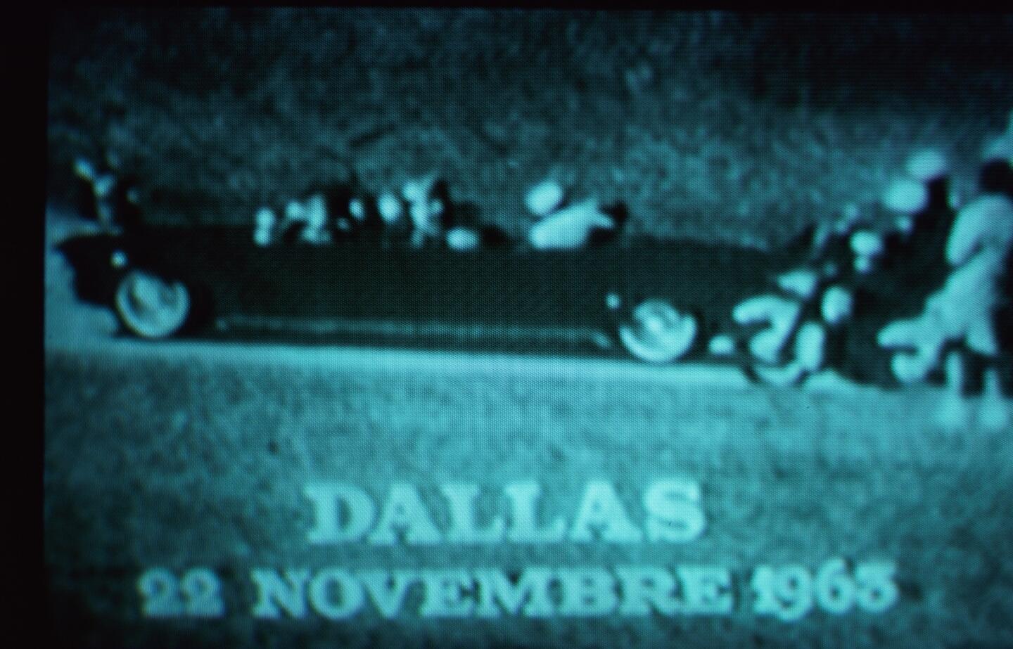 A photo of a May 1977 television broadcast of President John F. Kennedy and his wife, Jacqueline, in the presidential limousine in Dallas' Dealey Plaza moments after the president was shot dead on Nov. 22, 1963.