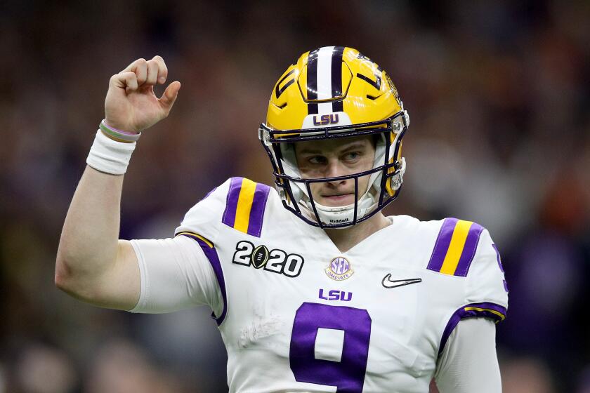 NEW ORLEANS, LOUISIANA - JANUARY 13: Joe Burrow #9 of the LSU Tigers reacts to a touchdown against Clemson Tigers during the third quarter in the College Football Playoff National Championship game at Mercedes Benz Superdome on January 13, 2020 in New Orleans, Louisiana. (Photo by Chris Graythen/Getty Images)