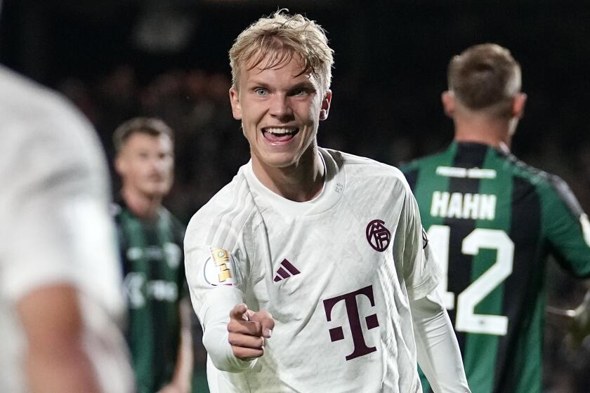 Bayern's scorer Frans Kraetzig celebrates after scoring his very first goal in a regular match for Bayern during the German Soccer Cup first round match between Preussen Muenster and Bayern Munich in Muenster, Germany, Tuesday, Sept. 26, 2023. (AP Photo/Martin Meissner)