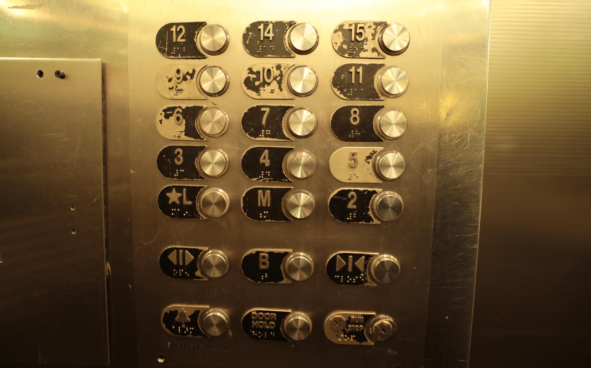 The worn buttons in the one functioning elevator at the Cecil Hotel.