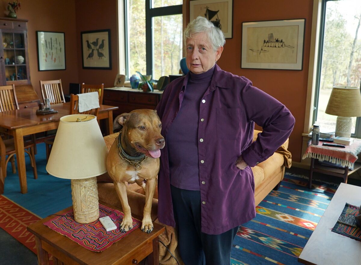 Annetta Cheek, with her dog, Keegan, at home in Hume, Va.