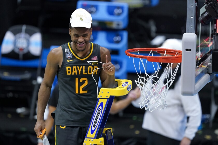 Baylor guard Jared Butler cuts down the net after the championship game against Gonzaga in the men's Final Four NCAA college basketball tournament, Monday, April 5, 2021, at Lucas Oil Stadium in Indianapolis. Baylor won 86-70. (AP Photo/Darron Cummings)