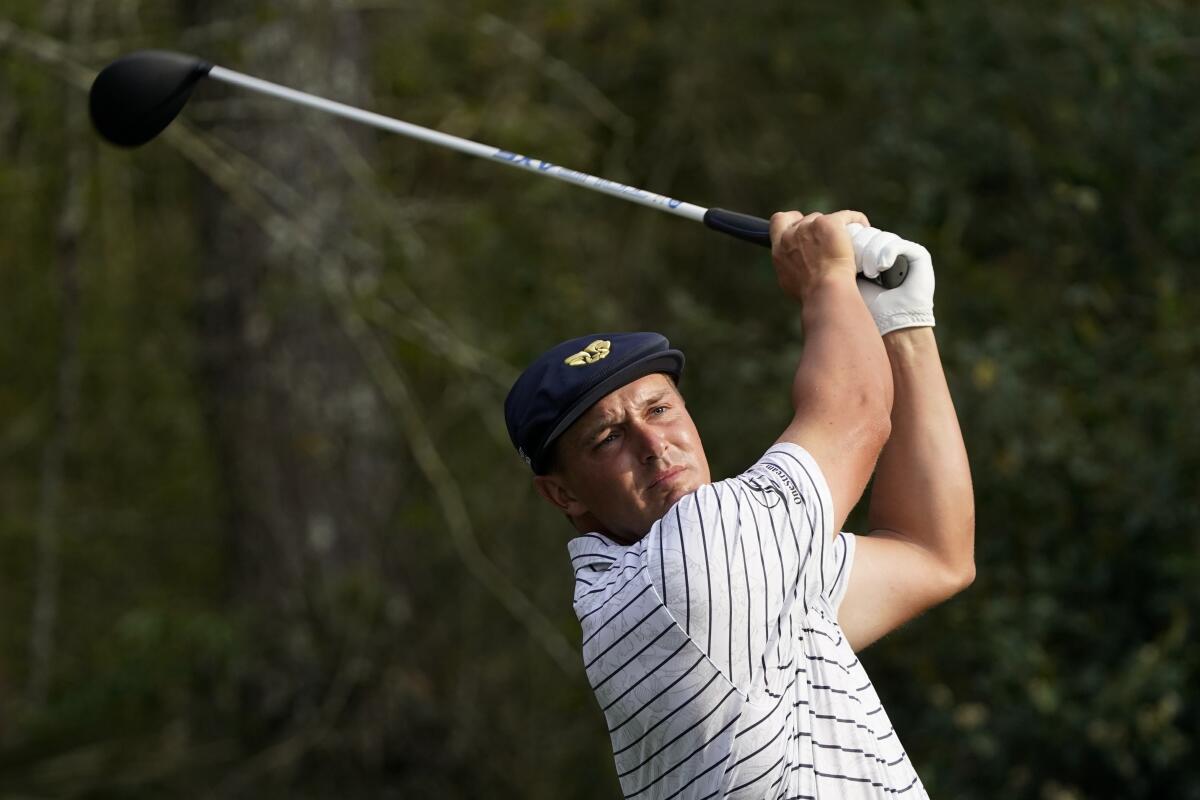 Bryson DeChambeau watches his tee shot on the 15th hole in the third round of the Players Championship on March 13, 2021.