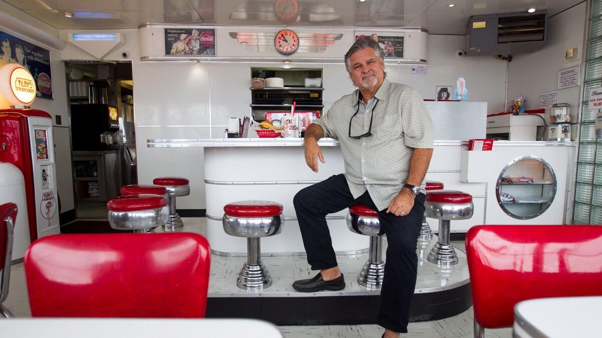 Doug Cavanaugh inside the Ruby's Diner at the Balboa Pier.