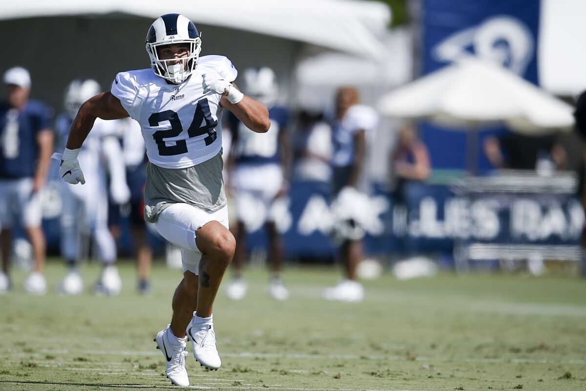 Rams safety Taylor Rapp sprints during a training camp session on July 29.
