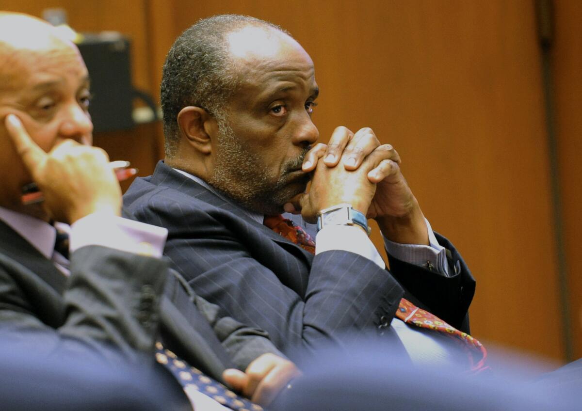 State Sen. Roderick Wright (D-Inglewood), right, listens during his perjury and voter fraud trial at Los Angeles Superior court. Roderick Wright has been convicted in a perjury and voter fraud case.